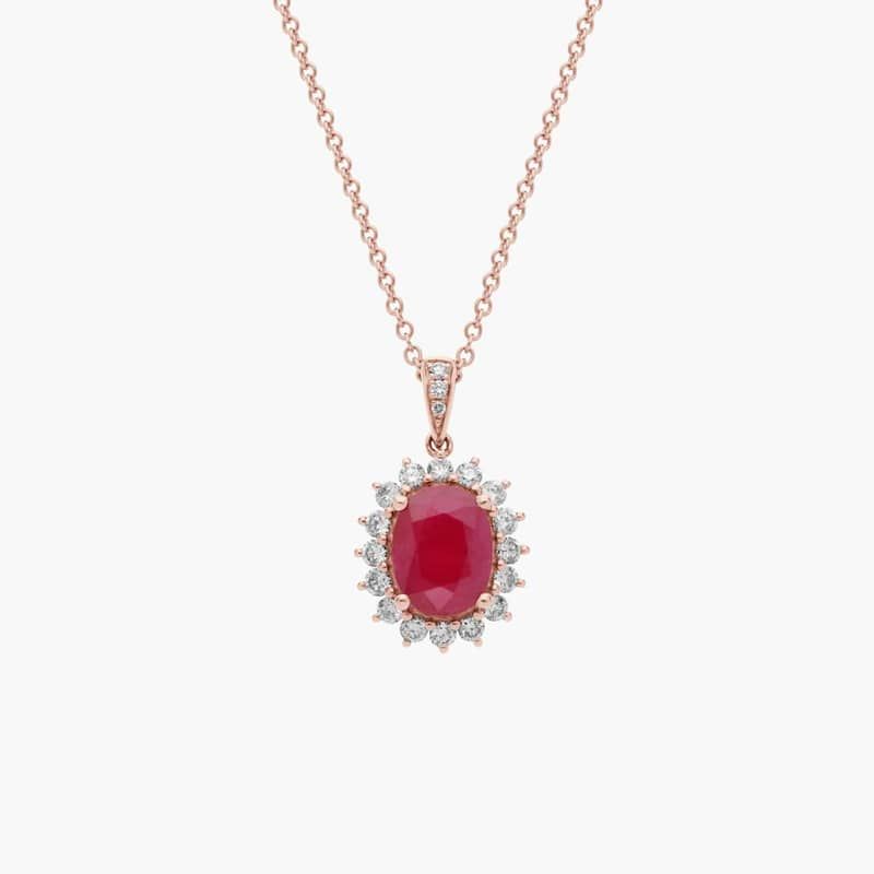 Oval Ruby and Diamond Sunburst Halo Pendant in 14k Rose Gold (9x7mm)