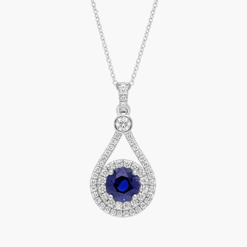 Extraordinary Collection: Blue Sapphire and Diamond Halo Pendant in Platinum