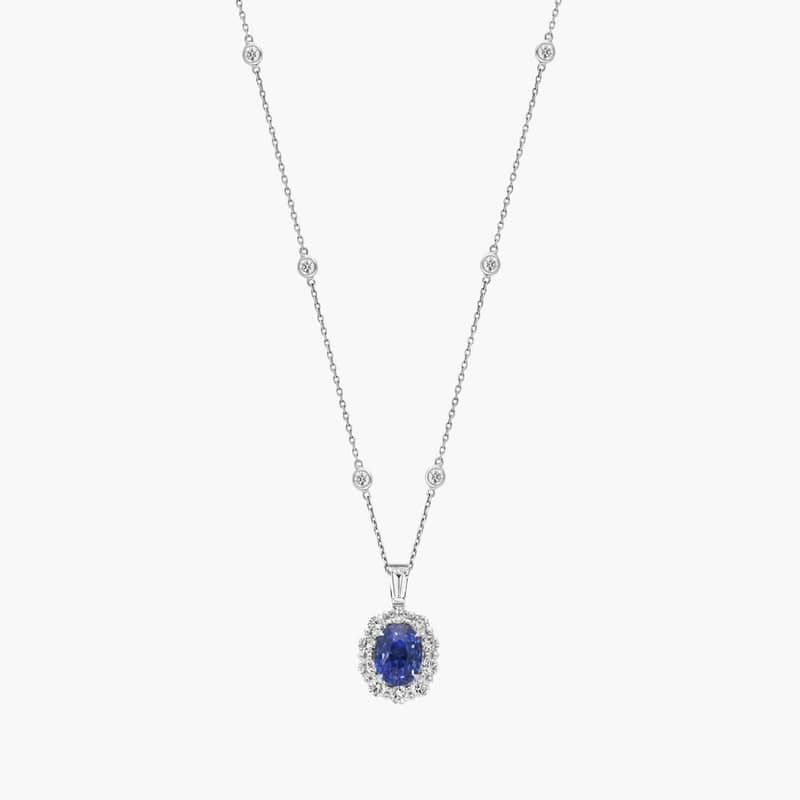 Oval Cut Sapphire & Diamond Halo Pendant Necklace with 3.5 CTW Baguette And Round Cut Diamonds in 18K White Gold