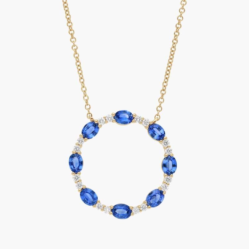 Oval Cut Blue Sapphire and Diamond Circle Pendant Necklace In 14K Yellow Gold