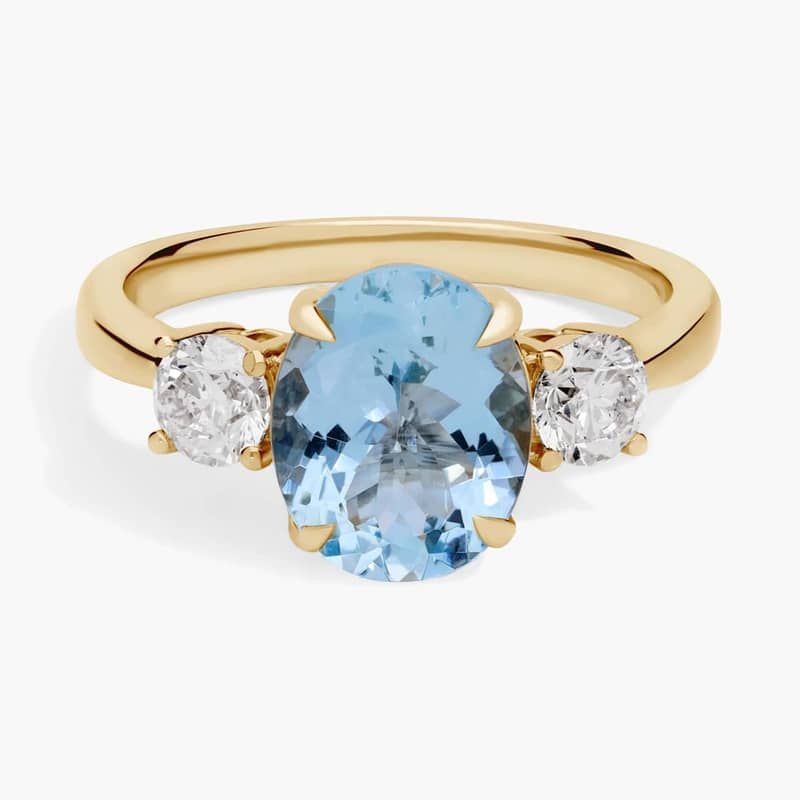 Oval Aquamarine and Diamond Sidestone Ring in 14k Yellow Gold