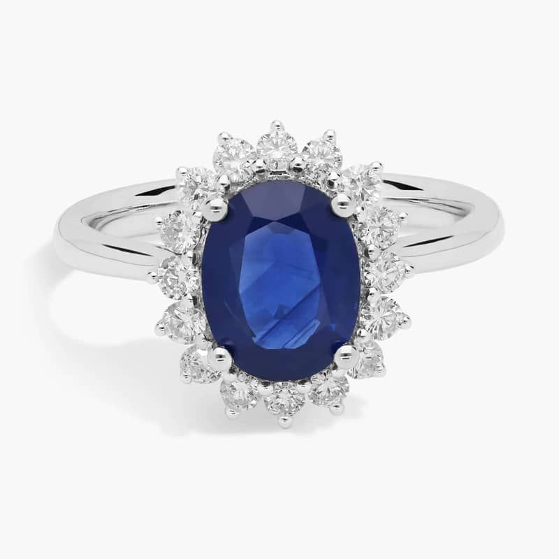 Oval Sapphire and Diamond Sunburst Halo Ring in 14k White Gold (9x7mm)