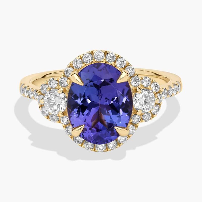 Oval Cut Tanzanite Diamond Side Stone Ring in 14k Yellow Gold (10x8mm)