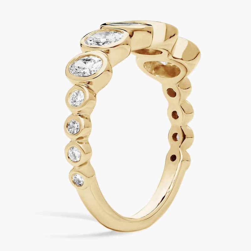 Oval Cut Graduated Lab-Grown Diamond Bezel Ring In 14K Yellow Gold