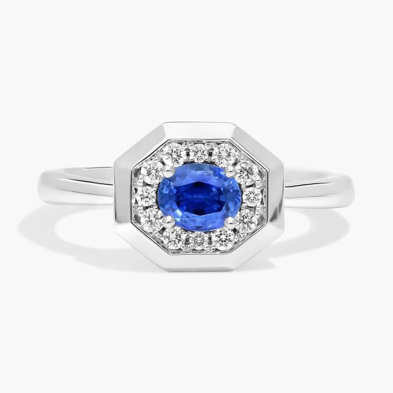 East-West Oval Cut Blue Sapphire and Pavé Diamond Ring In 14K White Gold