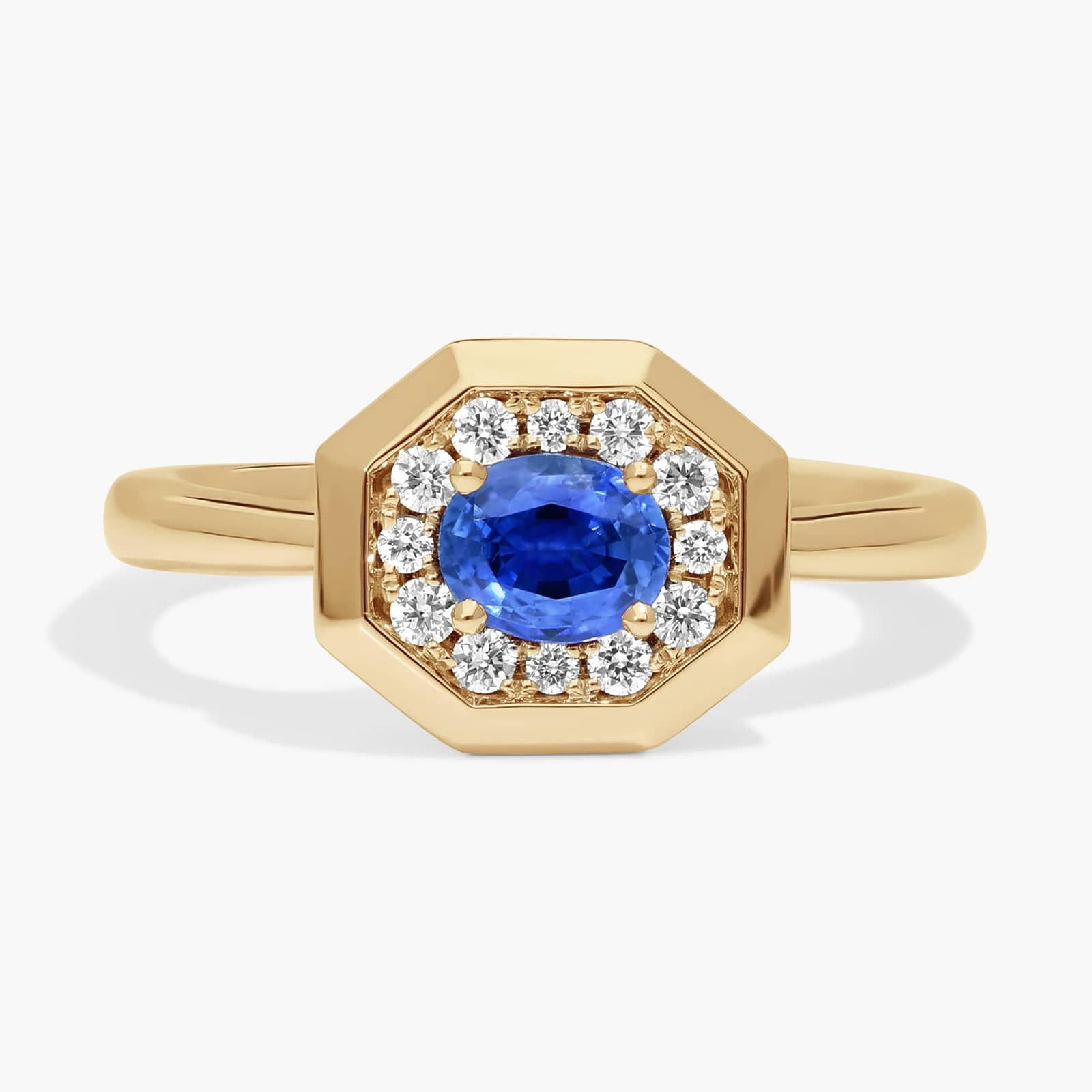 East-West Oval Cut Blue Sapphire and Pavé Diamond Ring In 14K Yellow Gold