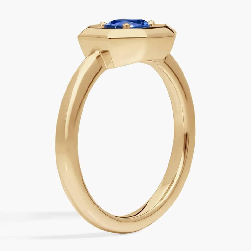 East-West Oval Cut Blue Sapphire and Pavé Diamond Ring In 14K Yellow Gold