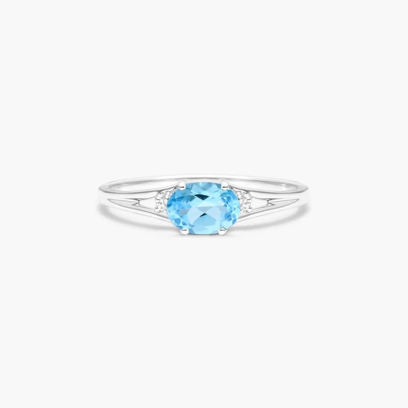 Oval Blue Topaz And Diamond Accent Birthstone Ring In 14K White Gold