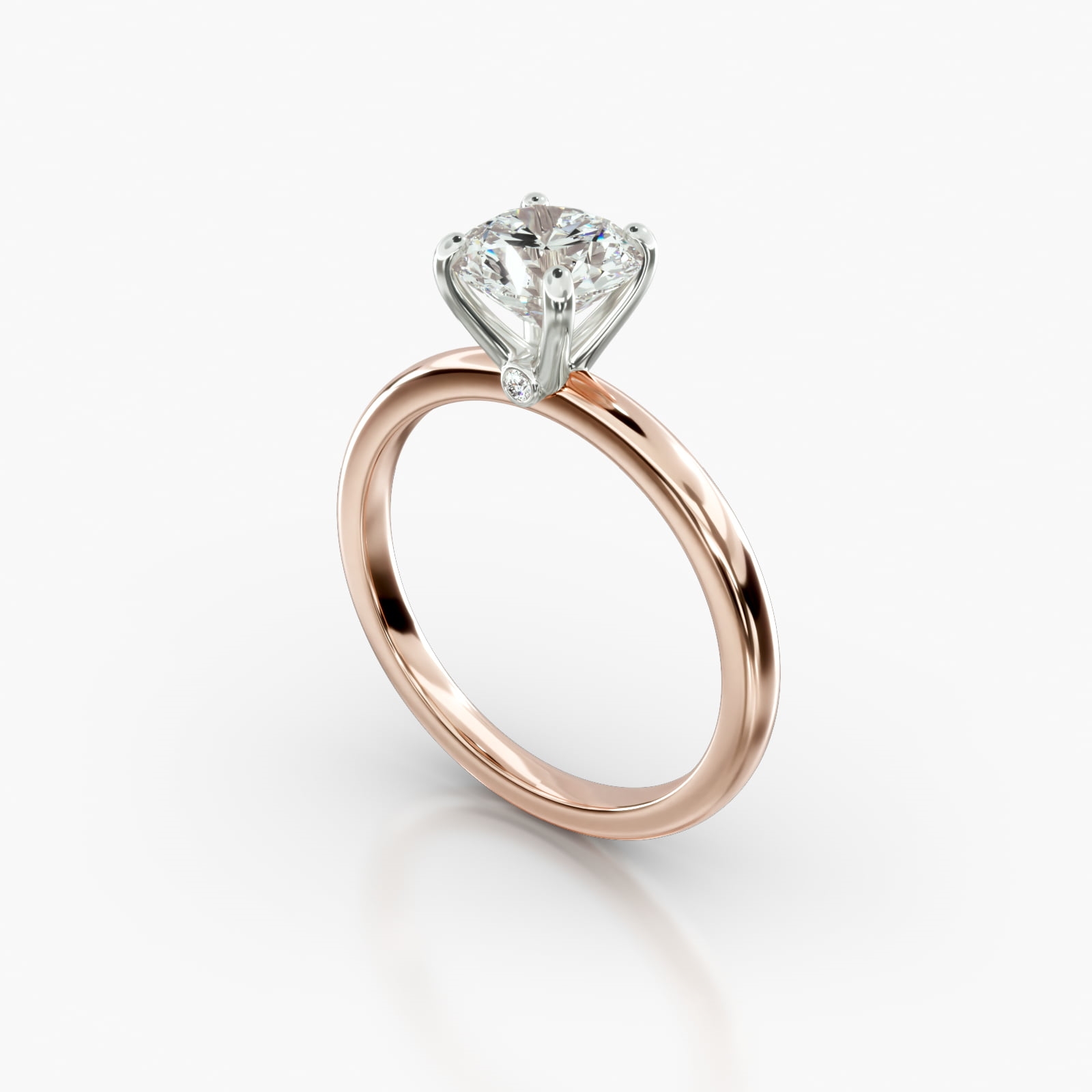 Solitaire Engagement Ring Embellished With a Four Prong Signature Head ...
