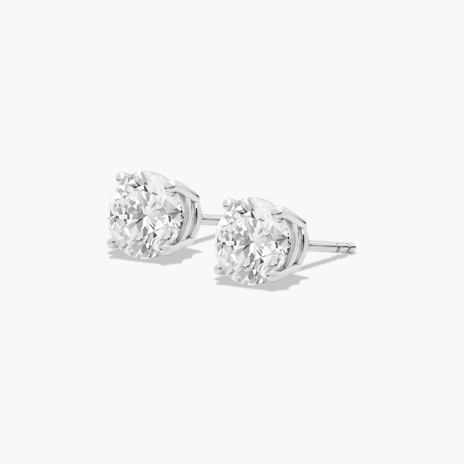 Platinum Four Prong Round Brilliant Diamond Stud Earrings (2.00 CTW - F-G / VS1-VS2)