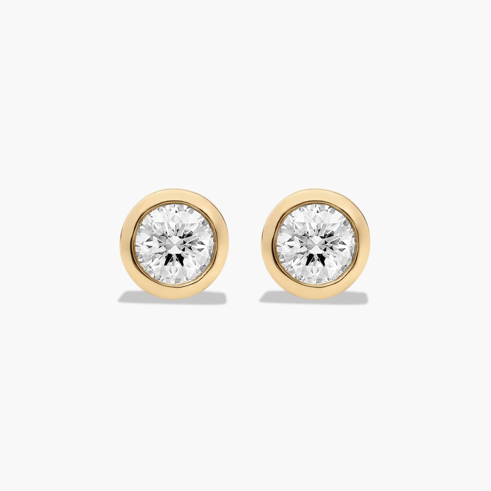 Bezel 0.5 CTW Diamond Stud Earrings In 14K Yellow Gold